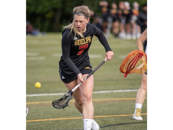 Emily Power playing lacrosse