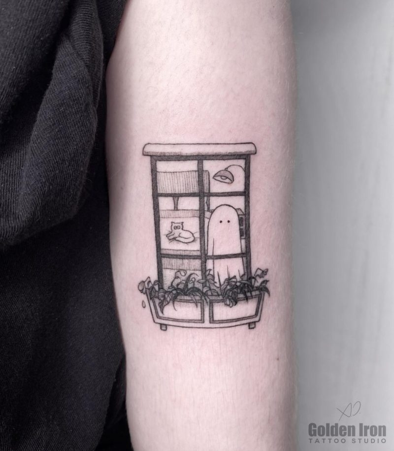 an arm tattoo of a ghost in a window